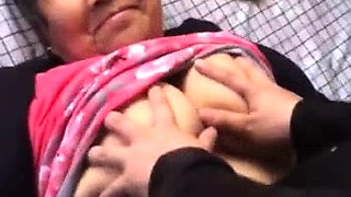 Curvy Chinese granny getting her big natural tits caressed