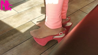 Shoeplay with High Heels in a Bar