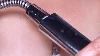 MILF Masturbates to Orgasm with a Handheld Shower