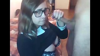 Beautiful college girl with glasses gives a blowjob