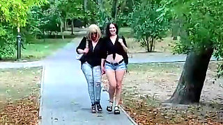 Two Lesbian Mistresses Are Strolling Through the Park