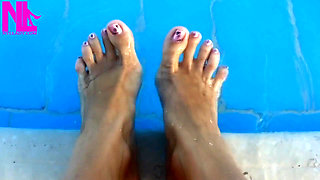 Barefoot Dangling in Swimming Pool Water