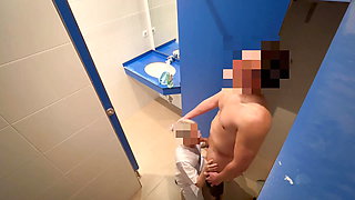 I surprise the cleaning lady at the gym giving me a handjob in the bathroom and she helps me finish cumming with a blowjob
