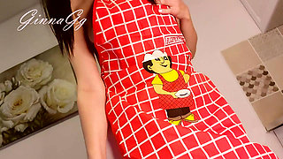 Hot housewife sexually rustles her apron in the kitchen