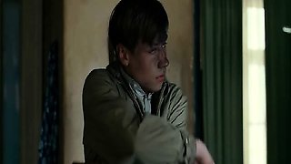 Kate Winslet naked standing behind a guy beside a bath tub,