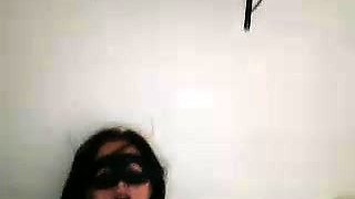 Masked brunette milf has fun with sex toys on the webcam