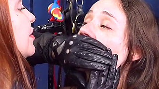 Mistress Elysia Slams Slave Mila Against Wall to Put Hand Over Her Face, Ending in Steamy Lesbian BDSM Kiss