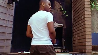 Two smallish blonde girls share a ebony man in bed with