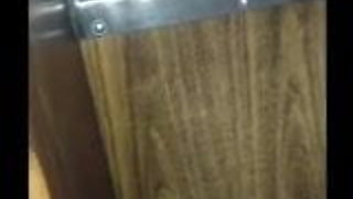 Tattooed brunette enjoys a stranger in the gloryhole