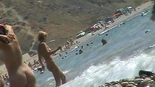 Voyeur video of nude girls having fun on a nudist beach