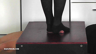 The Slave's Orgasm Under Mistress Cleo's Stocking Feet