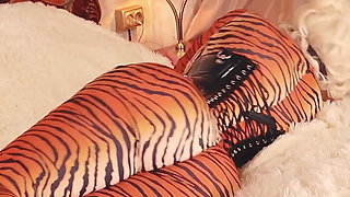 Submissive MILF gagged and bondage taped in spandex catsuit