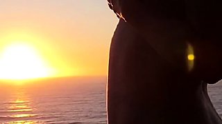 Buxom babe shows off sexy body in nude poses at sunset