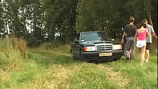 Mature Brunette Devours Cock in Wild Outdoor Group Bang