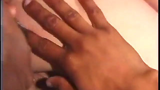 Black dude leans back so b-cup brunette can suck his huge cock and balls