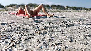 Hot MILF Masturbating on the Nudist Beach Got Caught on Camera