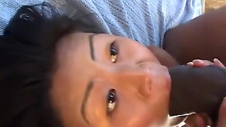 Horny Asian whore gives a messy blow job
