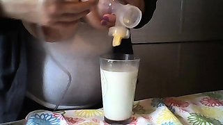 Hot babe with big boobs playing with her lactating boobs