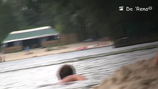 Staggering bitches are enjoying themselves on the beach