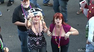 Slutty and shameless chicks show their big tits in the public