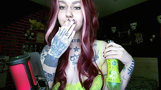Sexy Alternative Redhead Drinking Soda and Burping