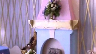 Heather Graham naked in the bath cup, while a guy enters