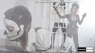 Glossy Black Latex Mistress Dominates Masked Sub With Strapon