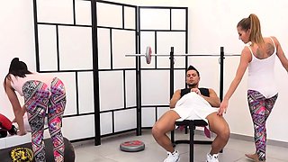 Fitness instructor fucks two teens in the gym