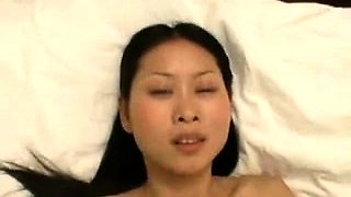 Adorable Thai babe takes a big shaft deep in her tight pussy
