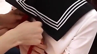 Gg50 - Cute Girl Challenges Herself to Break Free From the Restraints of Ropes and a Single Glove on the Bed.