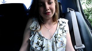Enticing camgirl puts her lovely tits on display in the car