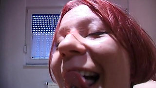 Redhead teen rubs and fingers her wet twat